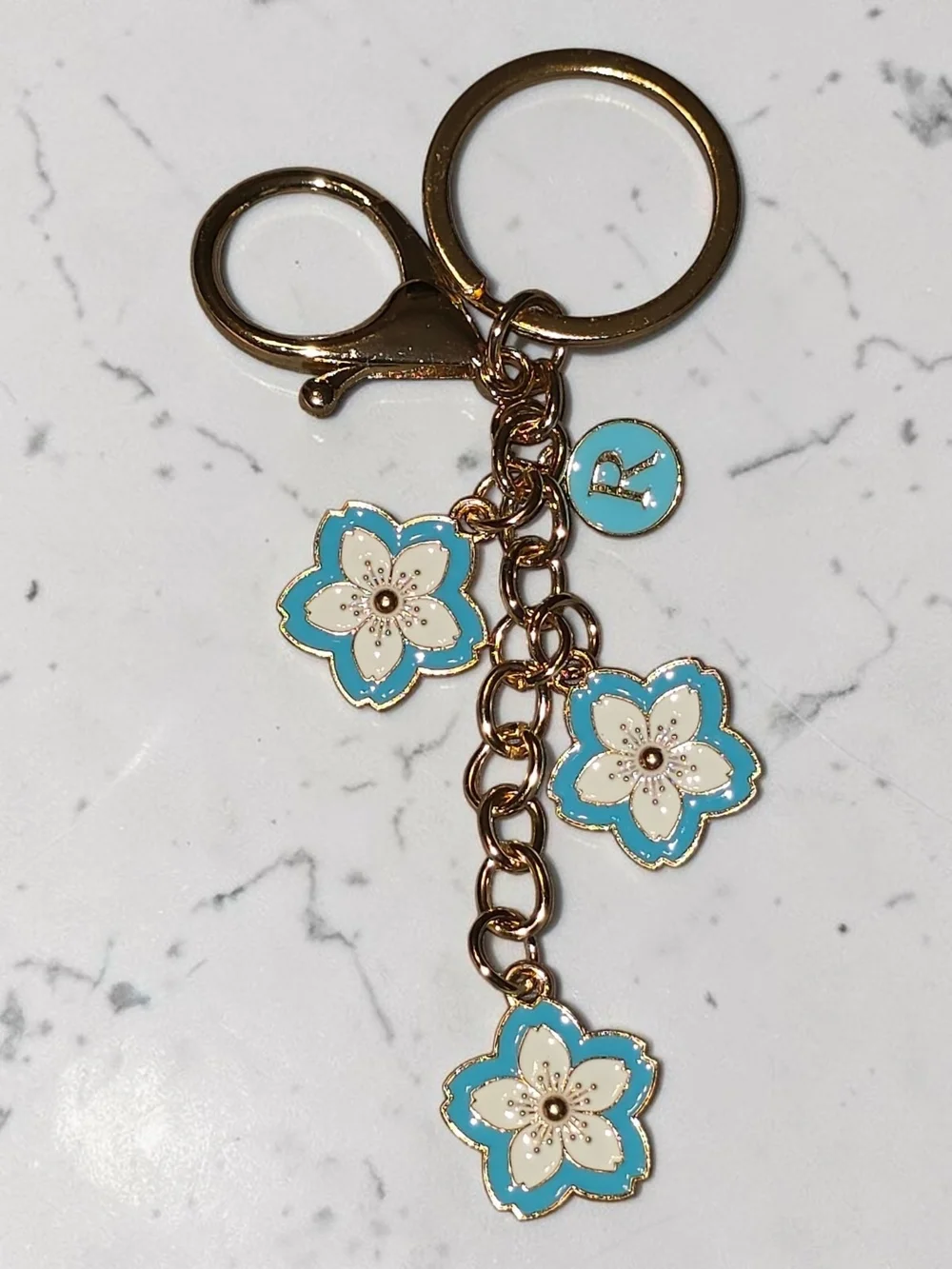Gold-Tone Keychain with Blue & White Floral Charms & Letter 